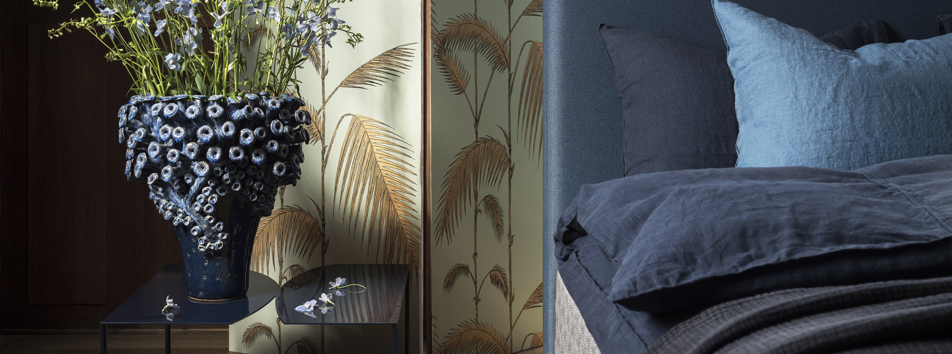 Close-up of the DUX bed model 1001 with blue Astoria headboard.